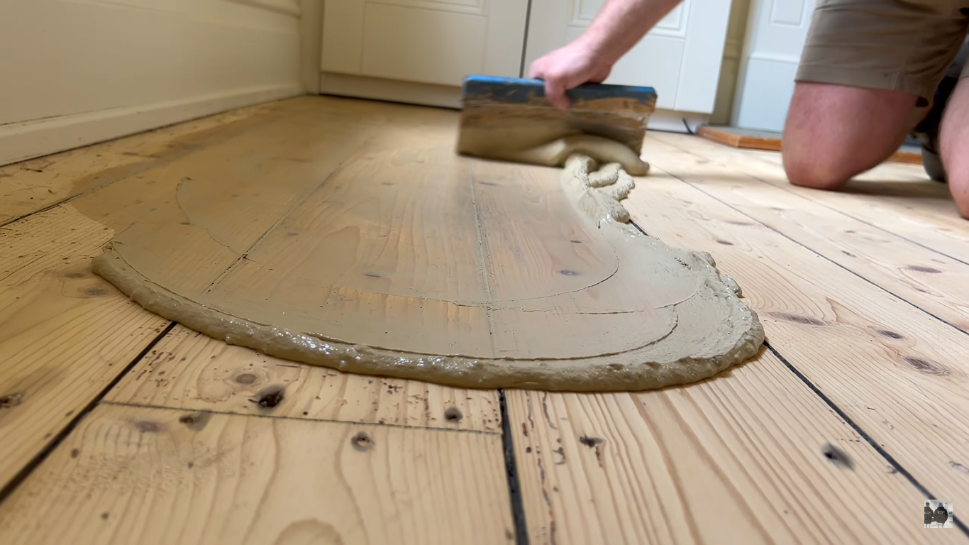 Wood Floor Sanding in South West London kitchen with resin gap filling on Victorian pine softwood floorboards before final sanding